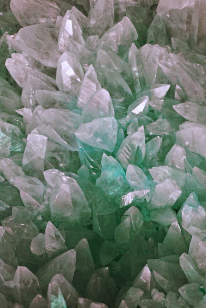 Close-up of shimmering aquamarine quartz crystals showcasing detail and translucency.
